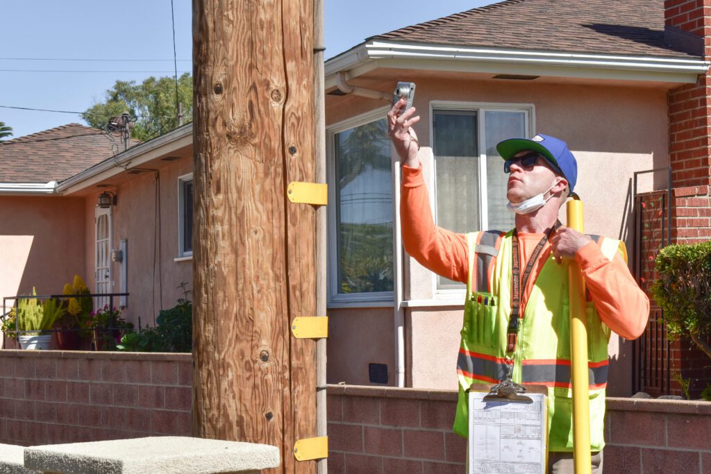 CHC Consulting Engineer In The Field Taking Photos